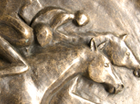 A stylised frost proof plaque for hanging on a wall showing three Race Horses reaching the finishing line. Suitable for the decoration of a stable yard.
Patinated in a dark bronze with highlights.