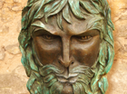The Green man is the medieval Spirit of Nature. He is suitable to hang on a wall and once connected to a small pump, water will spout from his mouth to the pond below. He has a fierce but good natured face and leaves for his hair and beard! The pipe work in the back is included.
He is patinated in a mid bronze with verdigrese coloured leaves.